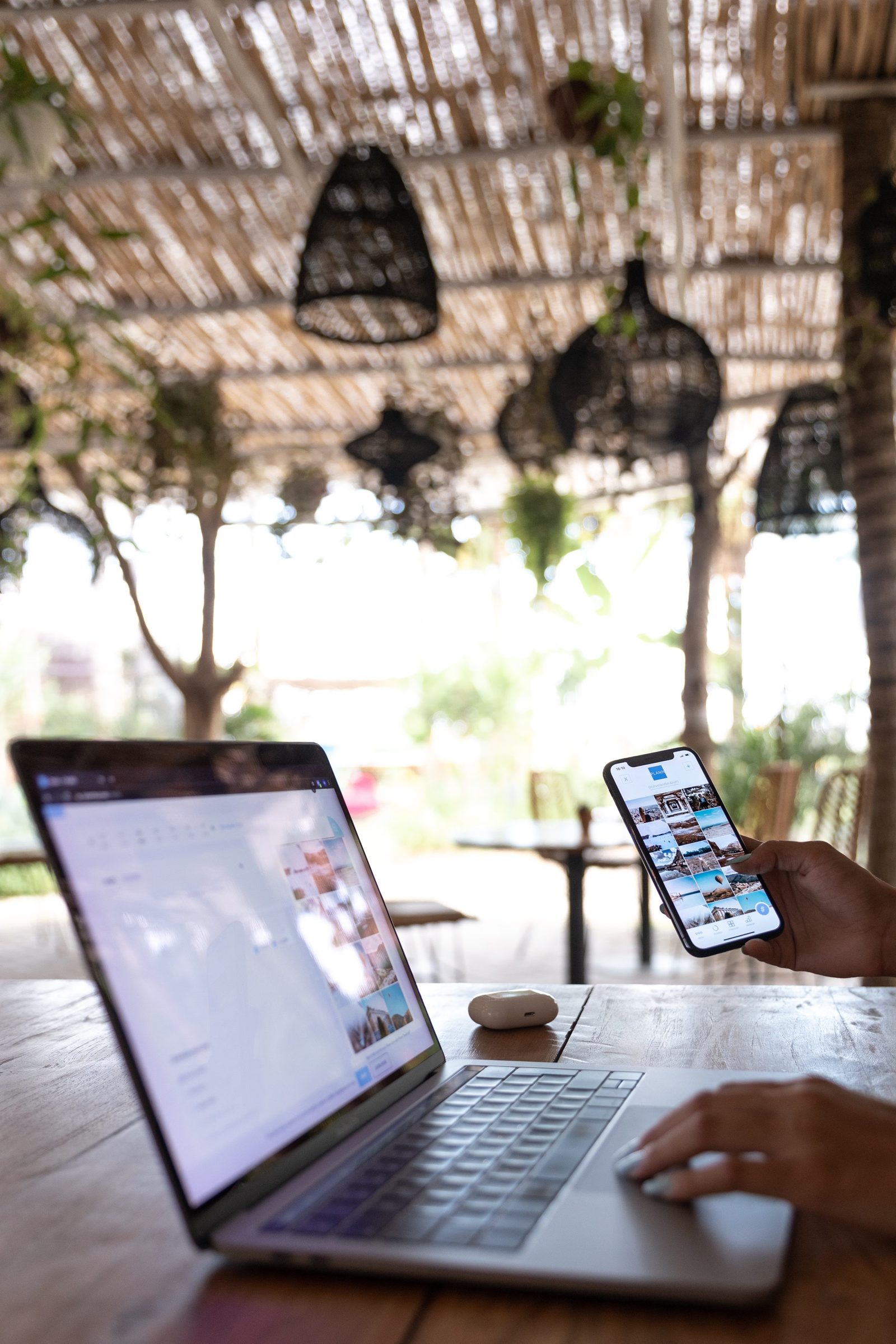 A remote worker on a laptop at an outdoor café in Bali: <em>a remote work and long-stay guide</em>