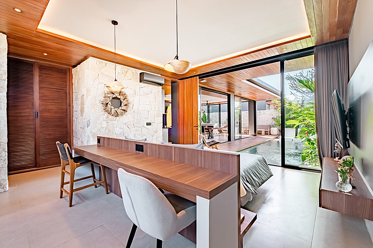 Open living room framed by jungle